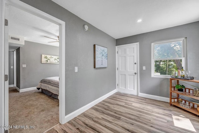 foyer featuring light hardwood / wood-style floors and ceiling fan