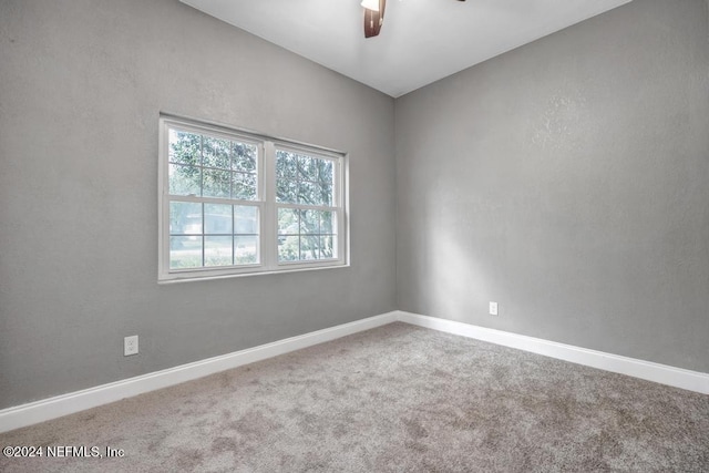 empty room featuring ceiling fan and carpet flooring