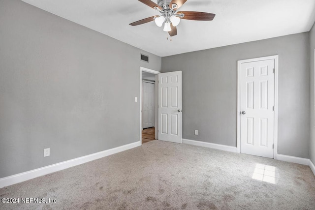 unfurnished bedroom with carpet and ceiling fan