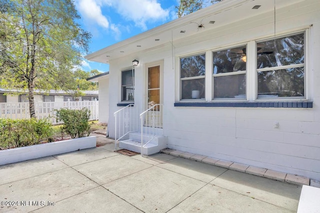 doorway to property featuring a patio area