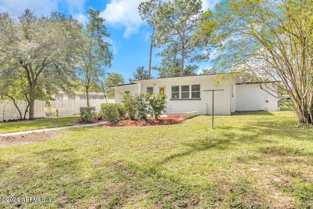 view of front of property with a front lawn