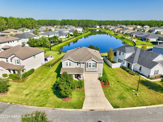 drone / aerial view with a water view