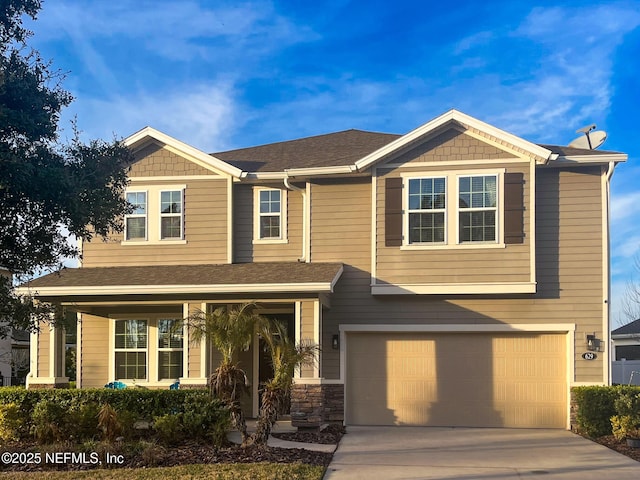 view of front of property with a garage