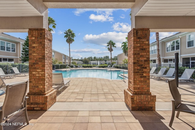 view of swimming pool with a patio