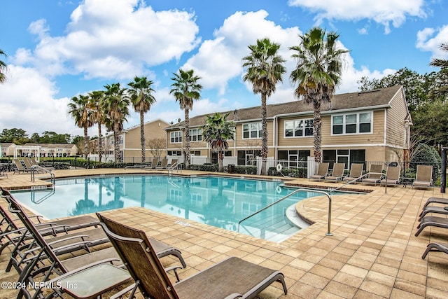 view of swimming pool featuring a patio area