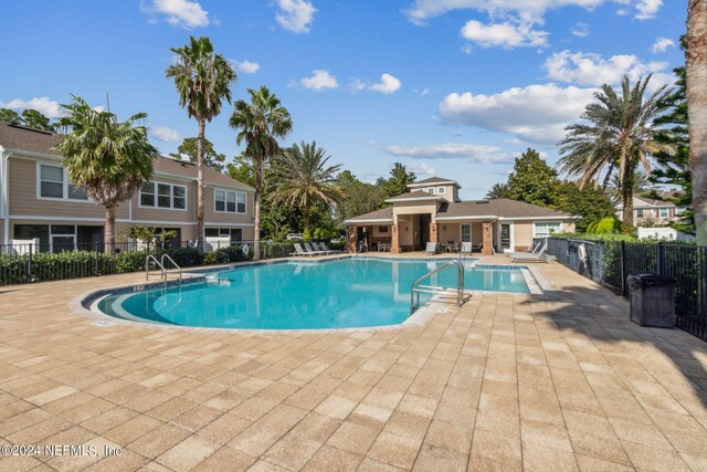 view of swimming pool featuring a patio area