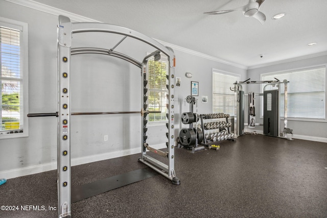 gym featuring ornamental molding, a textured ceiling, and ceiling fan