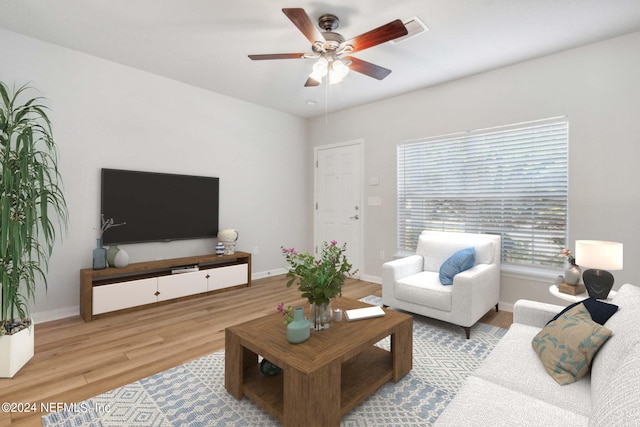 living room featuring light wood-type flooring and ceiling fan