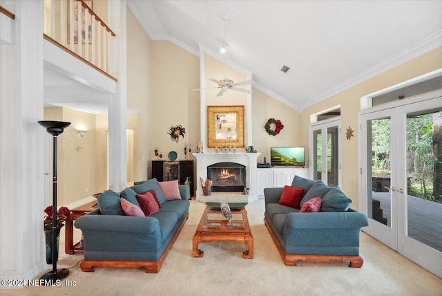 living room with high vaulted ceiling, ceiling fan, french doors, ornamental molding, and light colored carpet