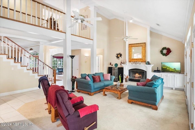 tiled living room with crown molding, ceiling fan, and high vaulted ceiling