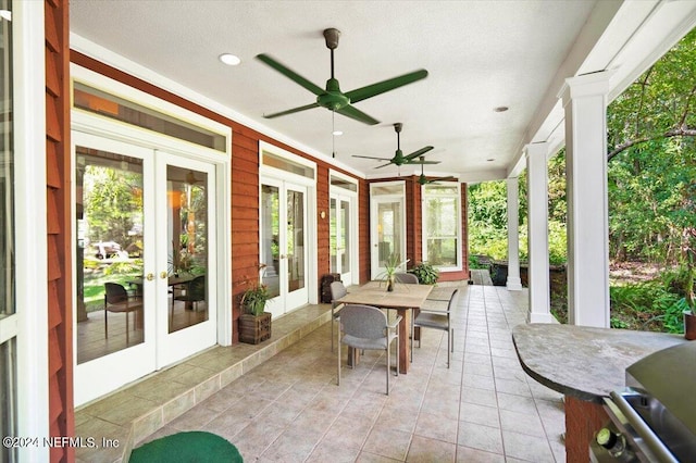 view of patio featuring ceiling fan and french doors