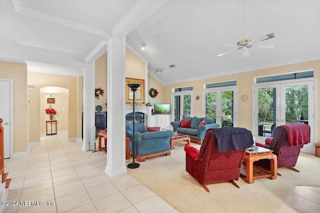 living room with light tile patterned floors, ceiling fan, french doors, vaulted ceiling with beams, and ornamental molding