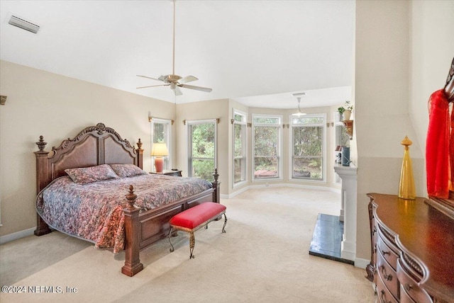 bedroom with light carpet and ceiling fan