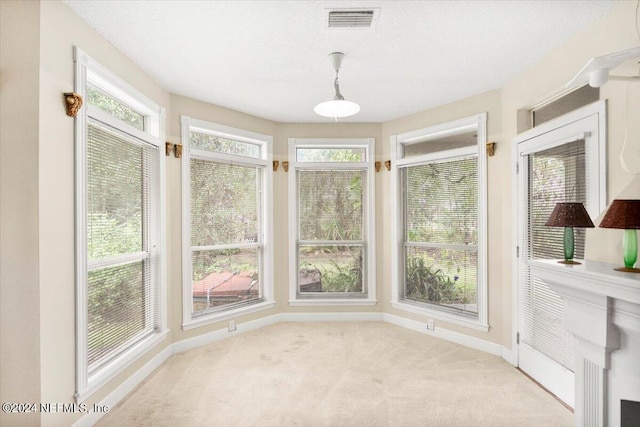 unfurnished sunroom featuring plenty of natural light