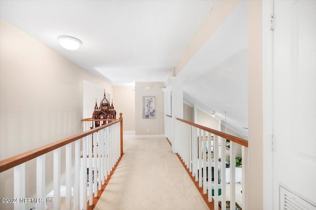 corridor with light colored carpet