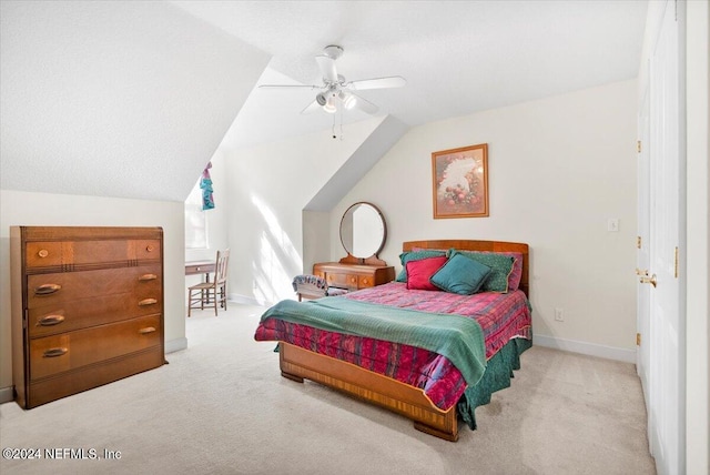 carpeted bedroom featuring ceiling fan and vaulted ceiling