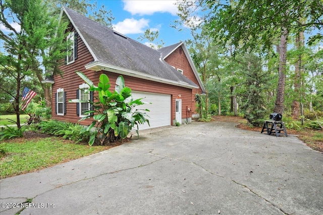 view of home's exterior with a garage