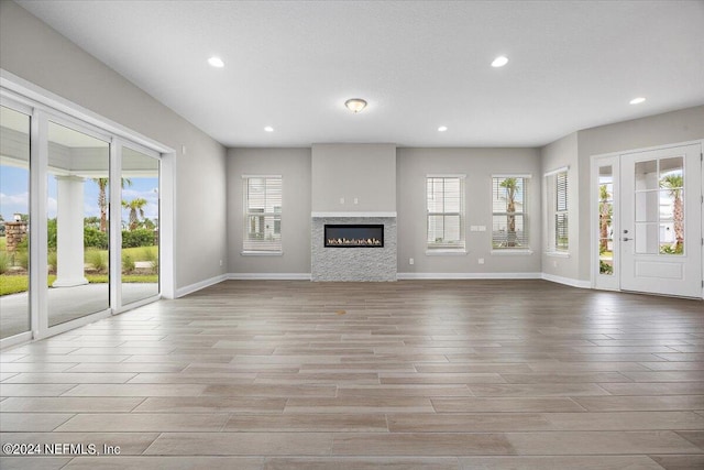 unfurnished living room with light wood-type flooring