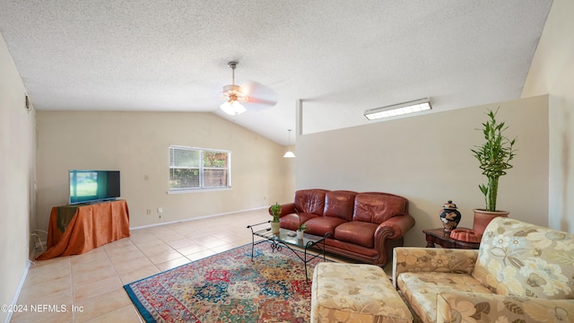 tiled living room featuring ceiling fan, a textured ceiling, and lofted ceiling