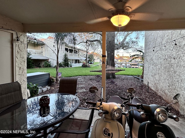 view of patio / terrace featuring ceiling fan