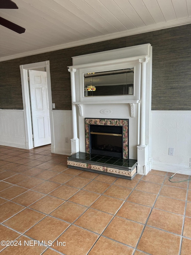 unfurnished living room featuring tile patterned flooring and a tiled fireplace