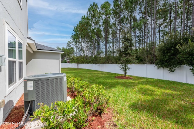 view of yard with central air condition unit