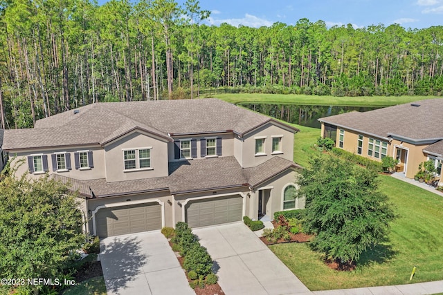 view of front of home featuring a front lawn and a garage