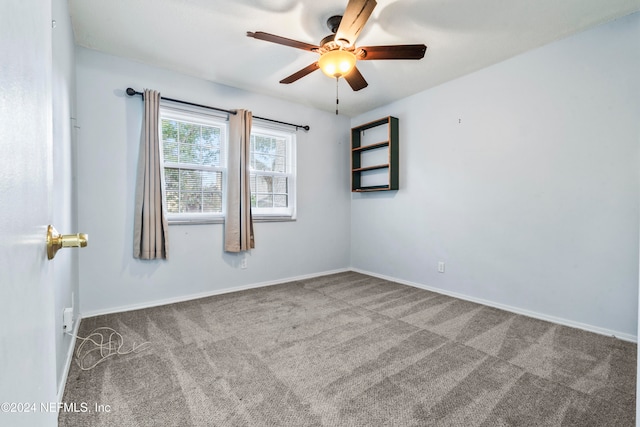 spare room with ceiling fan and carpet flooring