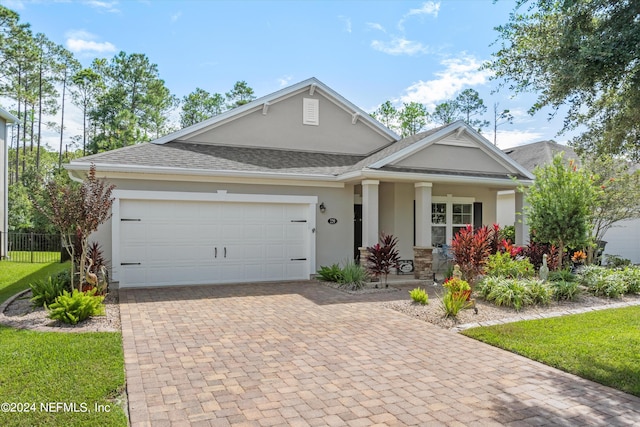 view of front of home with a garage