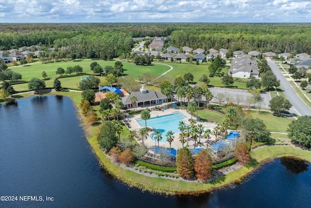 birds eye view of property with a water view