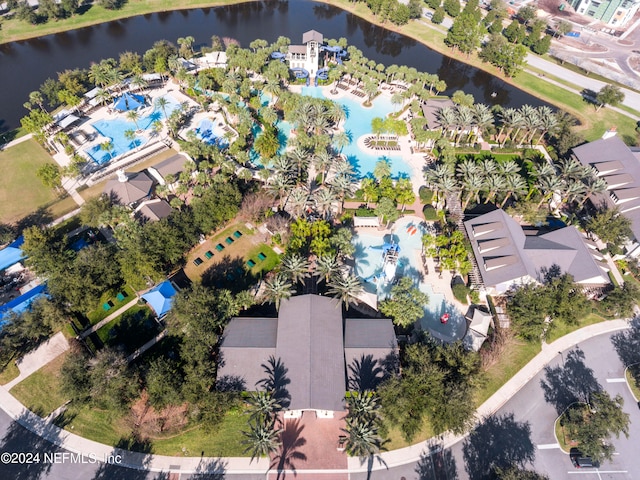 birds eye view of property with a water view