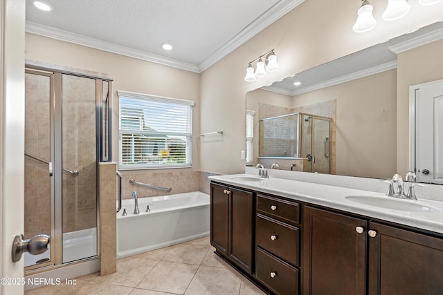 bathroom featuring separate shower and tub, ornamental molding, tile patterned floors, and vanity