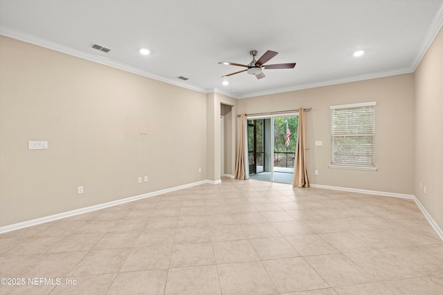 spare room featuring ceiling fan, light tile patterned floors, and ornamental molding