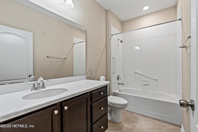 full bathroom featuring toilet, vanity, tile patterned floors, and shower / tub combination