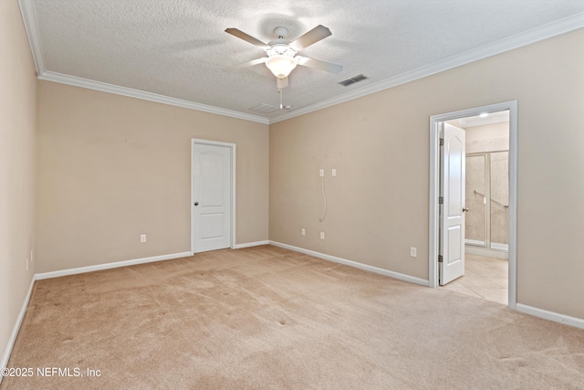 unfurnished room with light colored carpet, ceiling fan, crown molding, and a textured ceiling