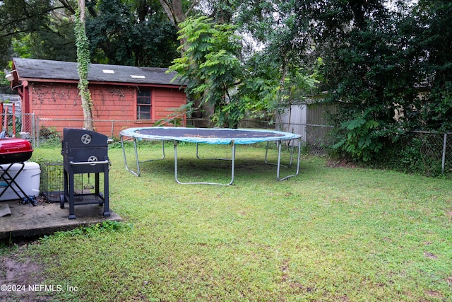 view of yard featuring a trampoline