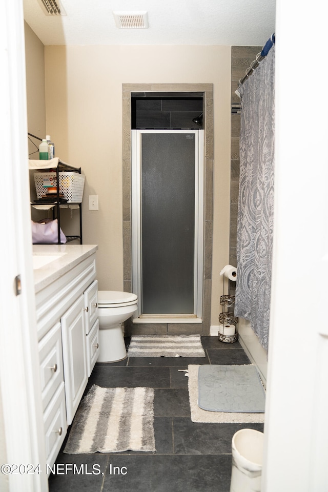 bathroom featuring vanity, toilet, and a shower with shower curtain