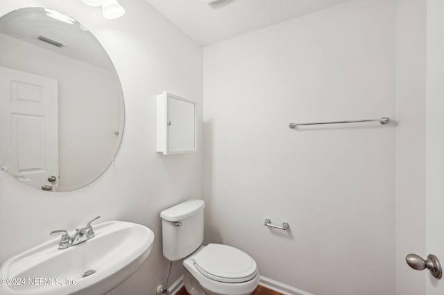 bathroom with sink and toilet