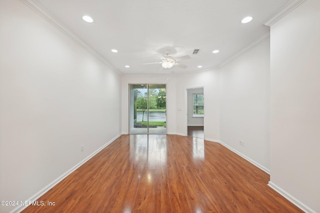 unfurnished room with ceiling fan, hardwood / wood-style flooring, and ornamental molding