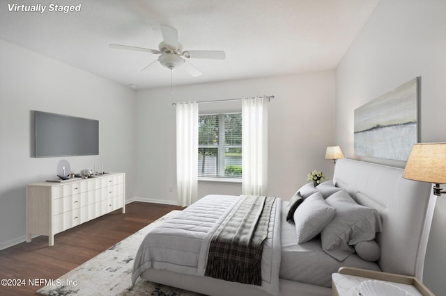 bedroom featuring ceiling fan and dark hardwood / wood-style floors