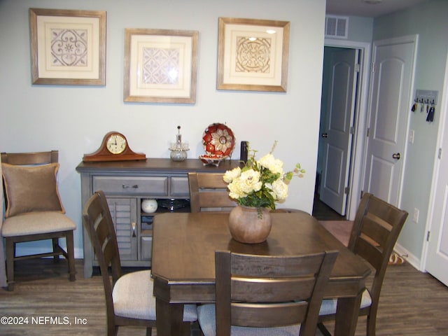 dining area featuring dark hardwood / wood-style floors