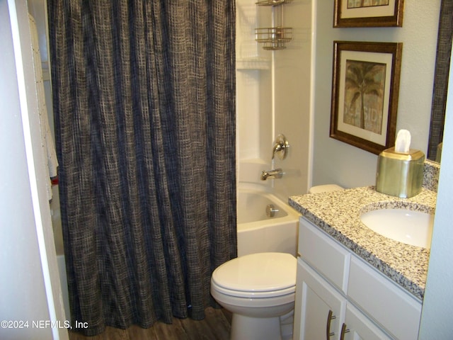 full bathroom with vanity, hardwood / wood-style floors, toilet, and shower / bathtub combination with curtain