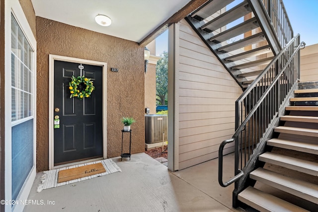 property entrance with central AC unit