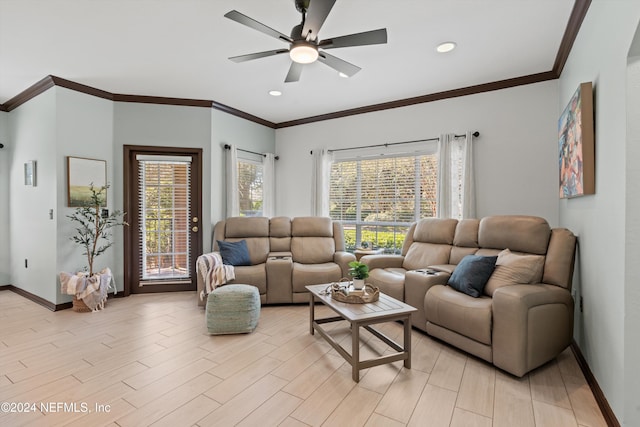 living room with ceiling fan, ornamental molding, and light wood-type flooring