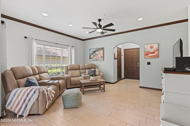 living room featuring ceiling fan, light hardwood / wood-style floors, and ornamental molding