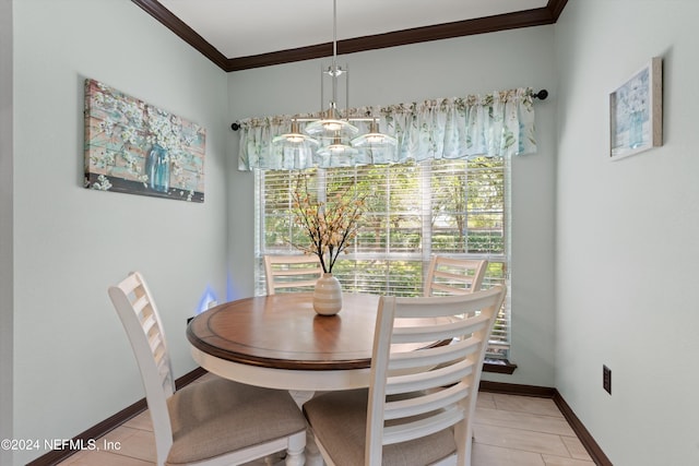 dining room featuring ornamental molding and light tile patterned flooring