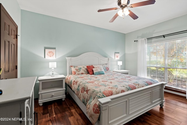 bedroom with ceiling fan and dark wood-type flooring