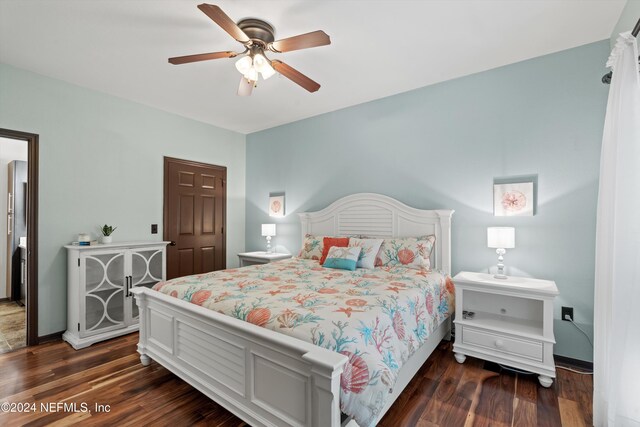 bedroom featuring ceiling fan and dark hardwood / wood-style floors