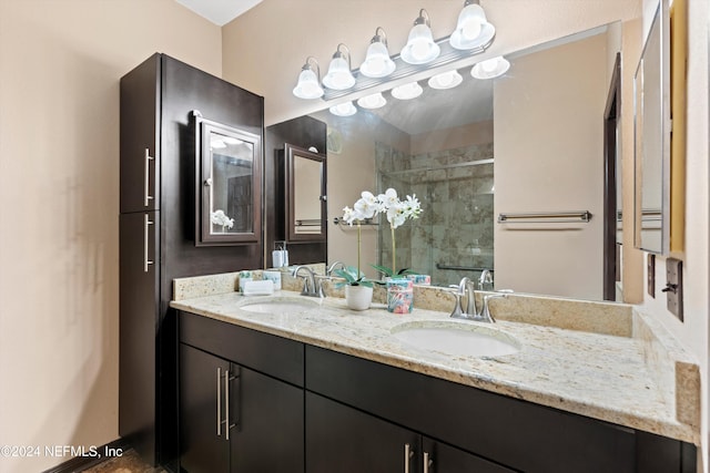 bathroom featuring vanity and a shower with door