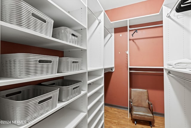 spacious closet featuring light hardwood / wood-style floors